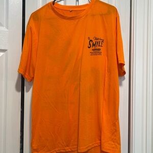Orange T-shirt with positive vibe quote on front and back